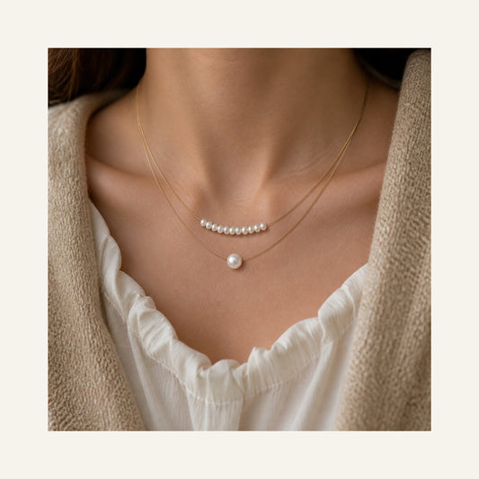 Double-Layer Natural Pearl Necklace in gold and pearl white, worn around the neck