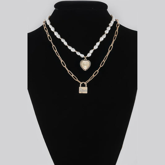 Pearl-Effect Heart & Lock Layered Necklace in gold and cream, displayed on a necklace bust