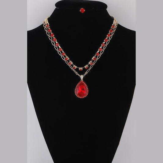 Jeweled Teardrop Layered Necklace in gold with red stones, displayed on a necklace bust