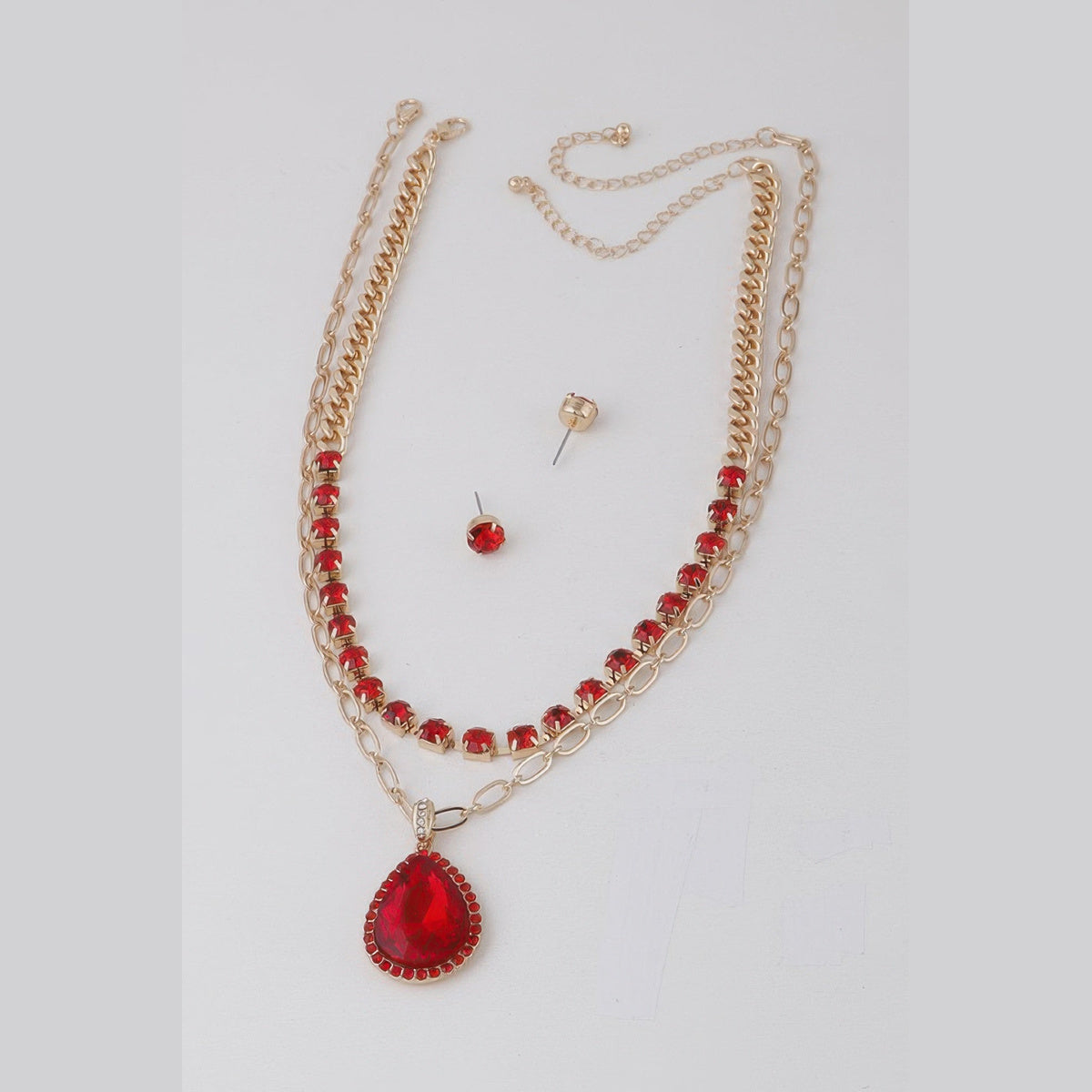 Jeweled Teardrop Layered Necklace in gold with red stones, flat lay