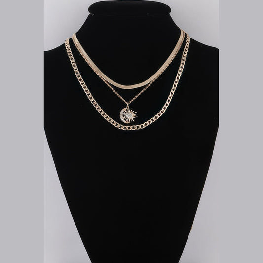 Sun & Moon Layered Necklace in gold with clear stones, displayed on a necklace bust