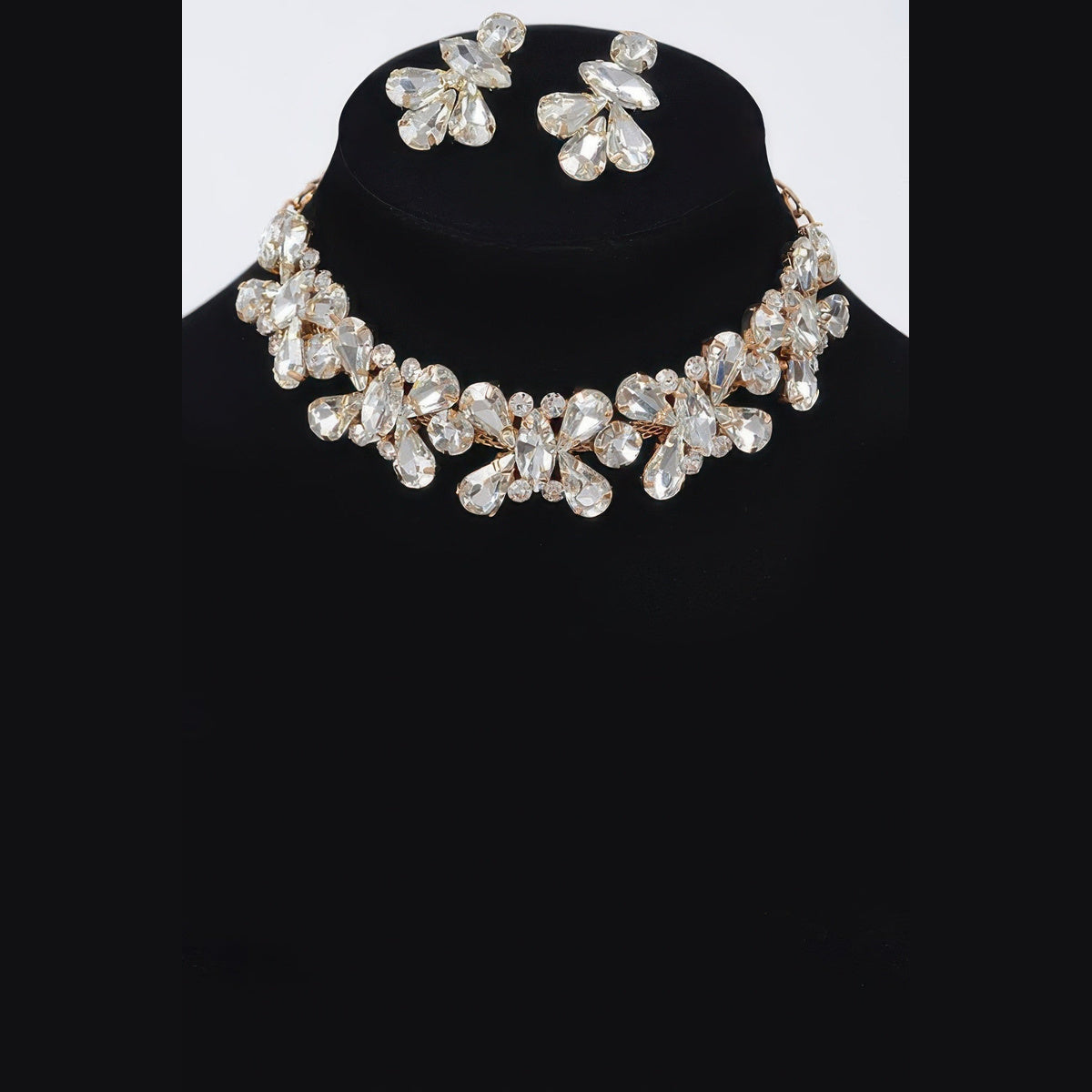 Floral Stone Necklace & Earring Set in gold with clear stones, necklace and earrings displayed together