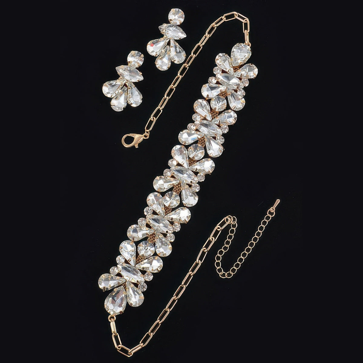 Floral Stone Necklace & Earring Set in gold with clear stones, necklace and earrings flat lay