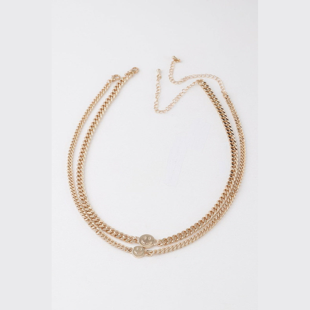 Smiley Disc Double-Chain Choker in gold, flat lay