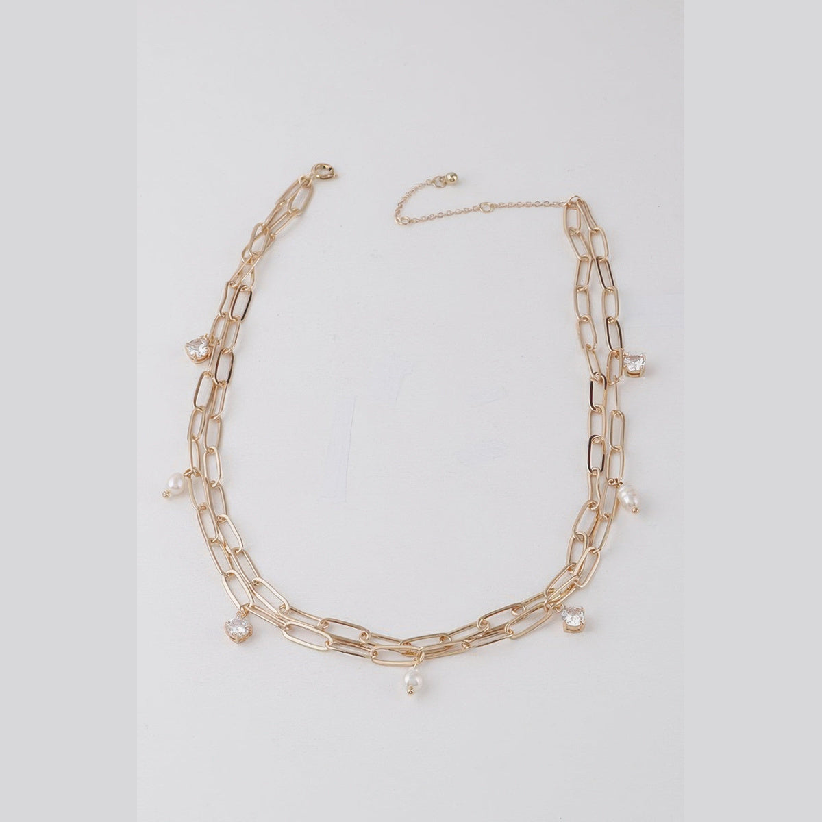 Pearl-Effect & Stone Paperclip Necklace in gold and cream, flat lay