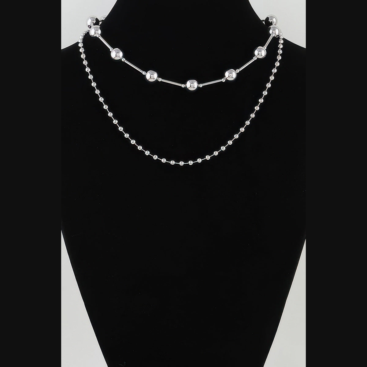Double-Layer Bead & Bar Necklace in silver, displayed on a necklace bust