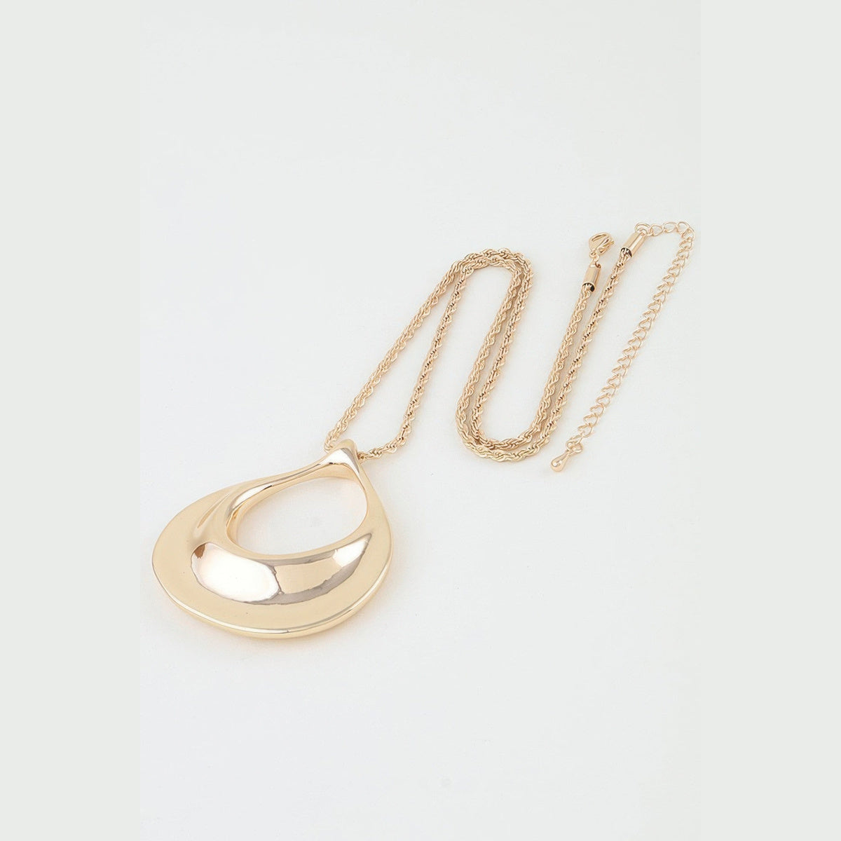 Sculptural Ripple Pendant Necklace in gold, chain and clasp detail