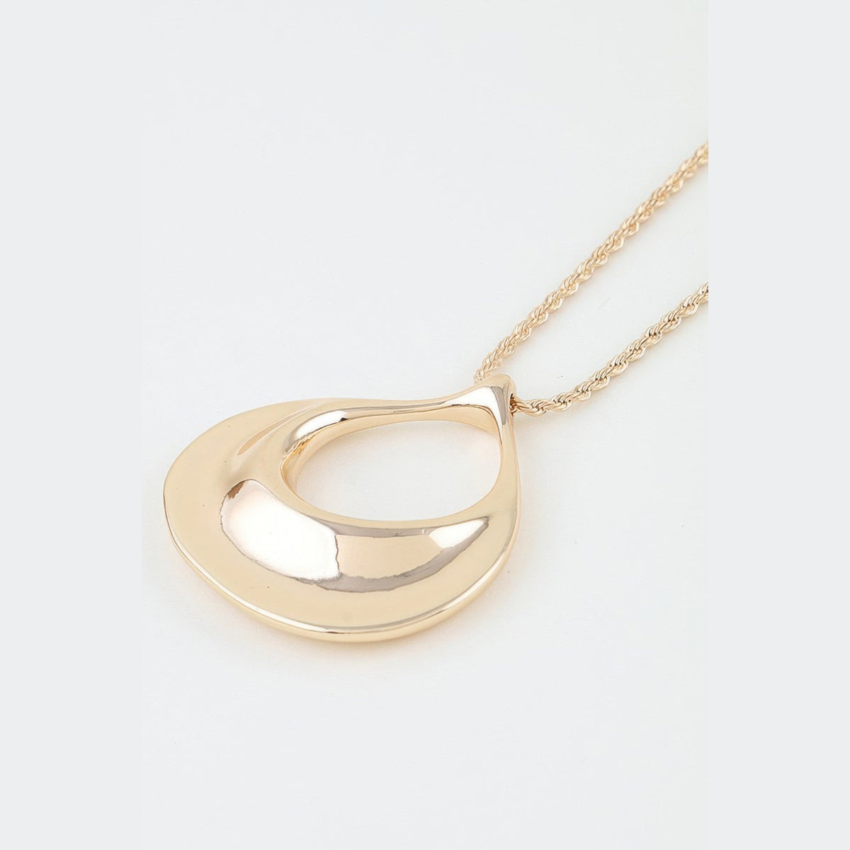Sculptural Ripple Pendant Necklace in gold, ripple pendant close-up