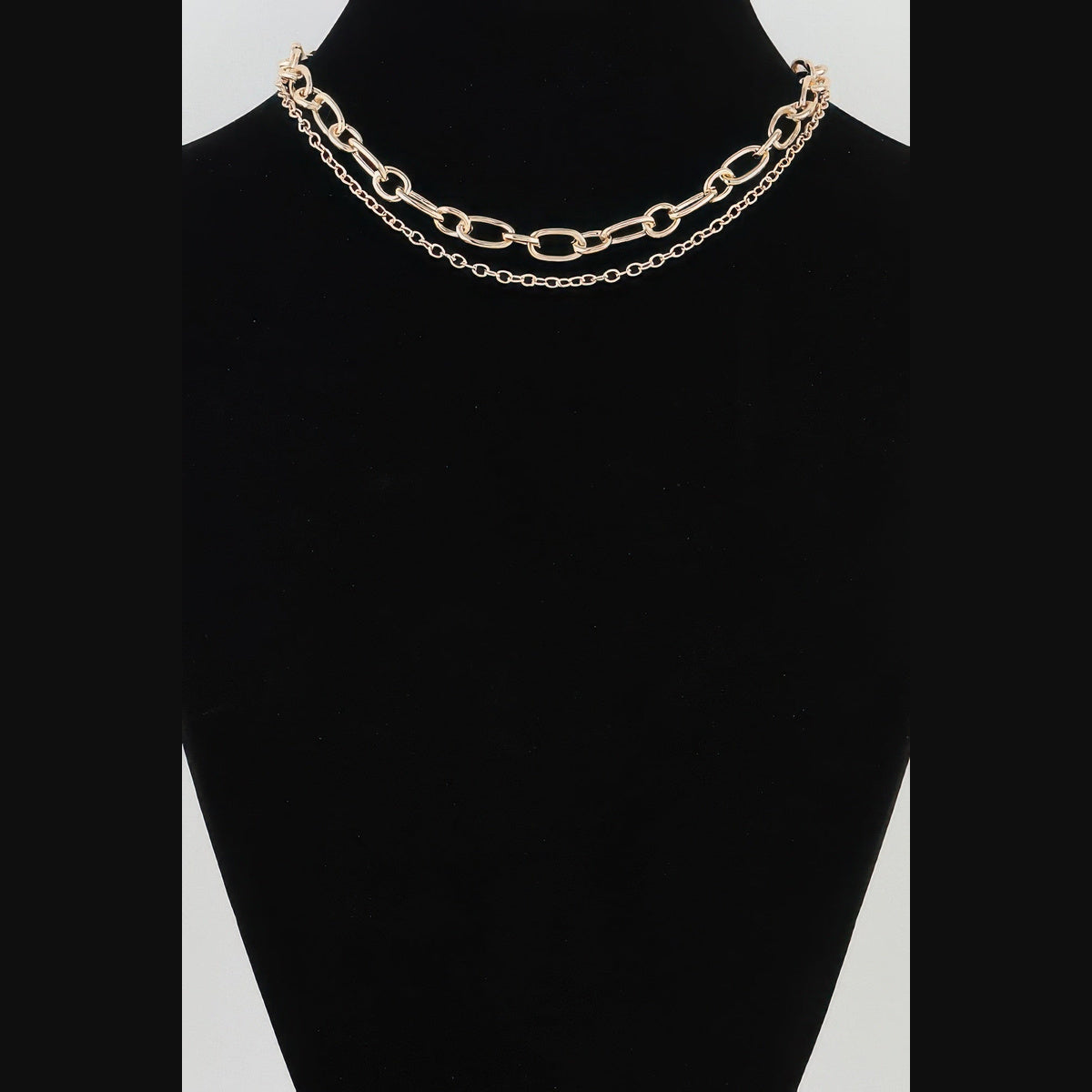 Polished Oval-Link Layered Necklace in gold, displayed on a necklace bust