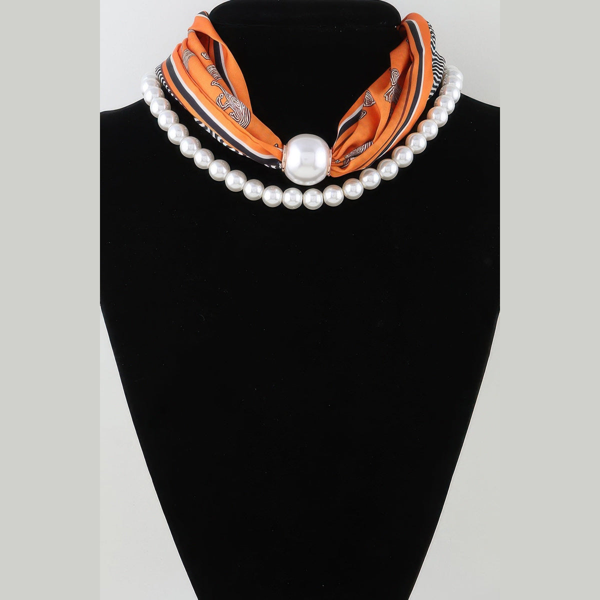 Scarf & Pearl-Effect Statement Necklace in orange, worn close to the neck