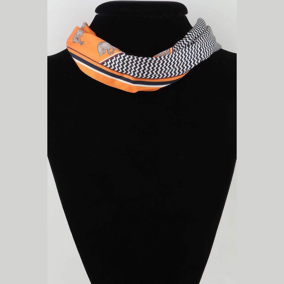 Scarf & Pearl-Effect Statement Necklace in orange, side view on a necklace bust