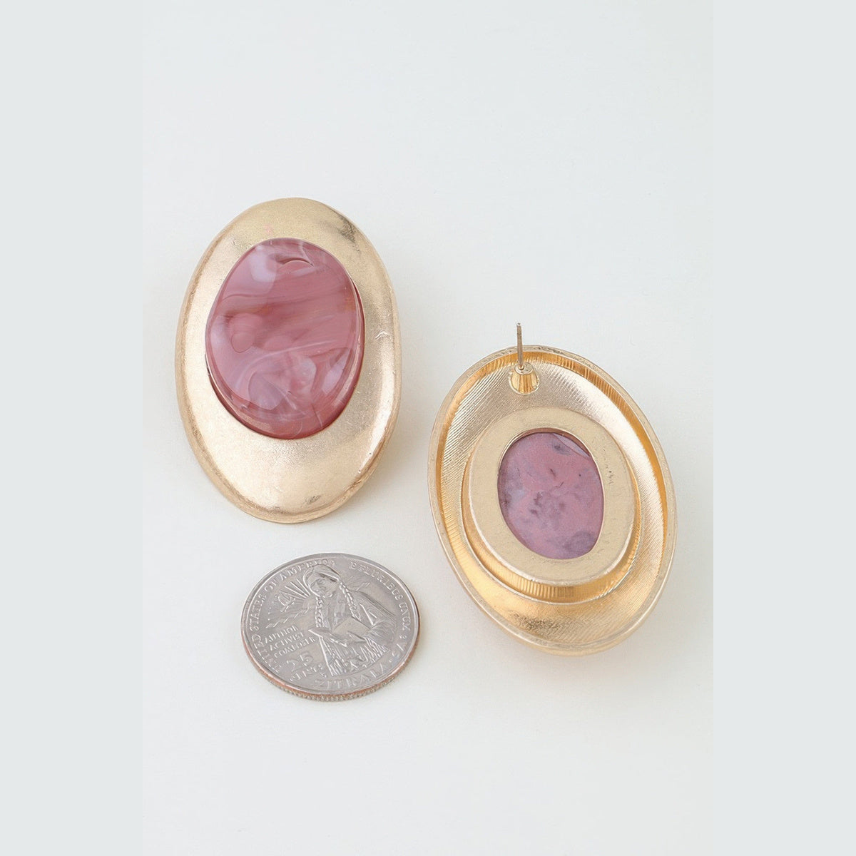 Matte Marbled Stone Statement Earrings in gold and light pink, front and reverse views beside a coin for scale