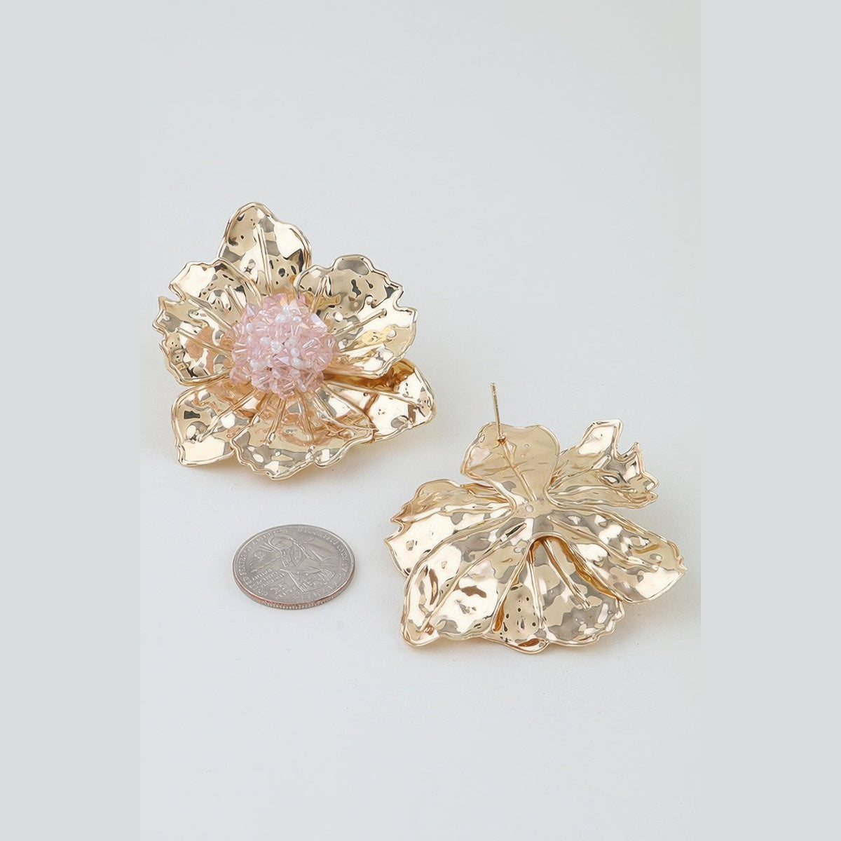 Pink Beaded Flower Statement Earrings in gold and pink, front and reverse views beside a coin for scale