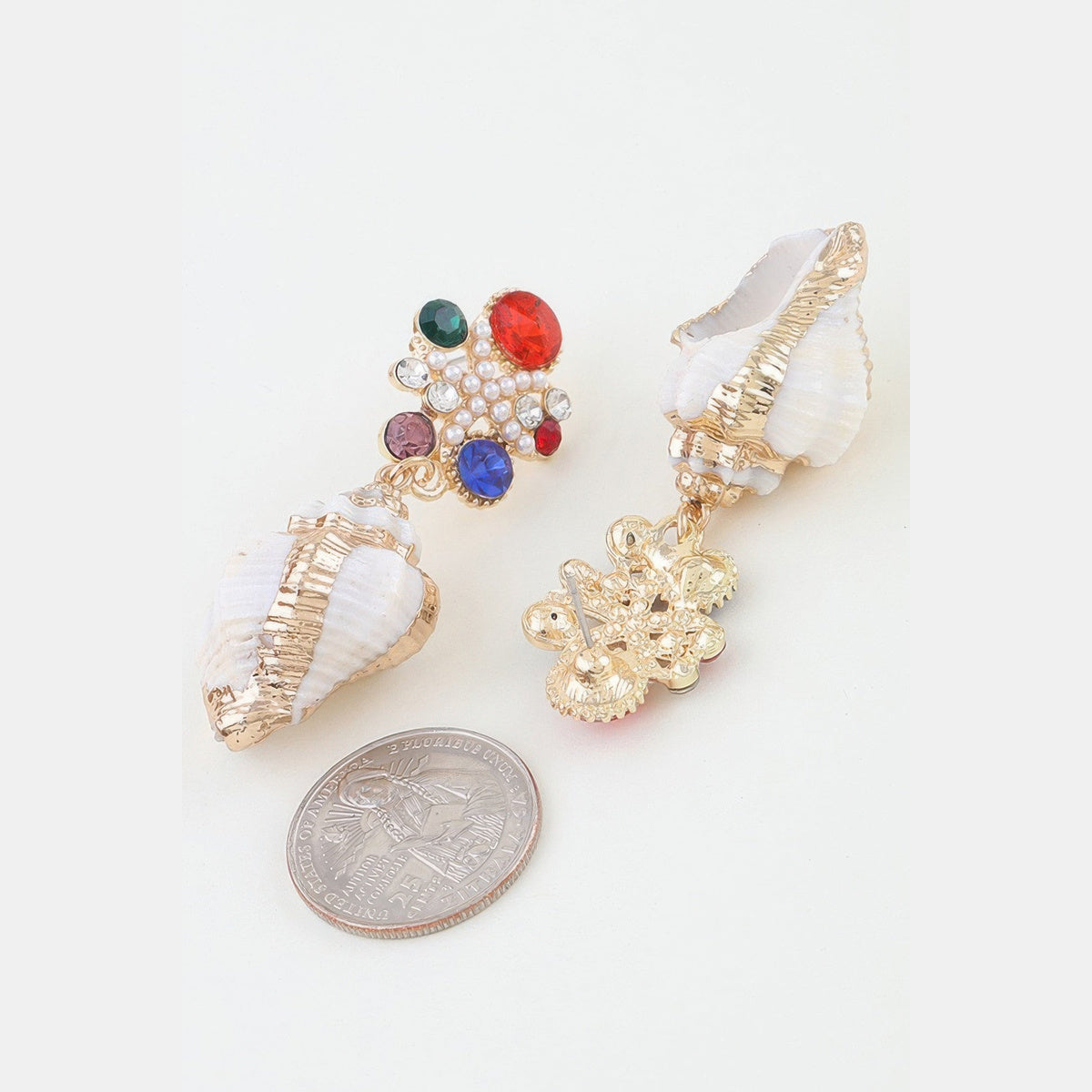 Jeweled Shell Statement Drop Earrings in gold with multicolor stones, reverse view beside a coin for scale