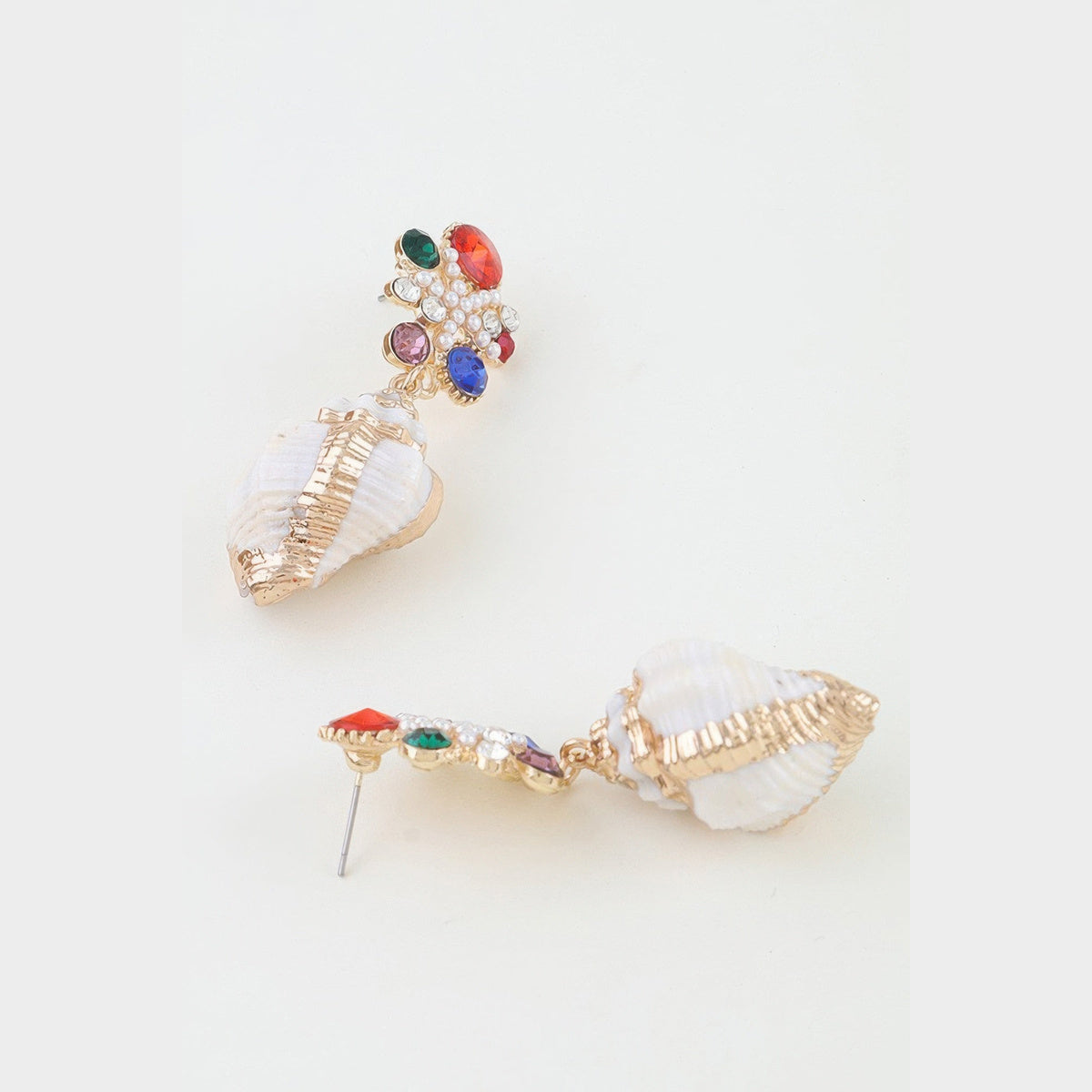 Jeweled Shell Statement Drop Earrings in gold with multicolor stones, side profile and earring posts beside a coin for scale