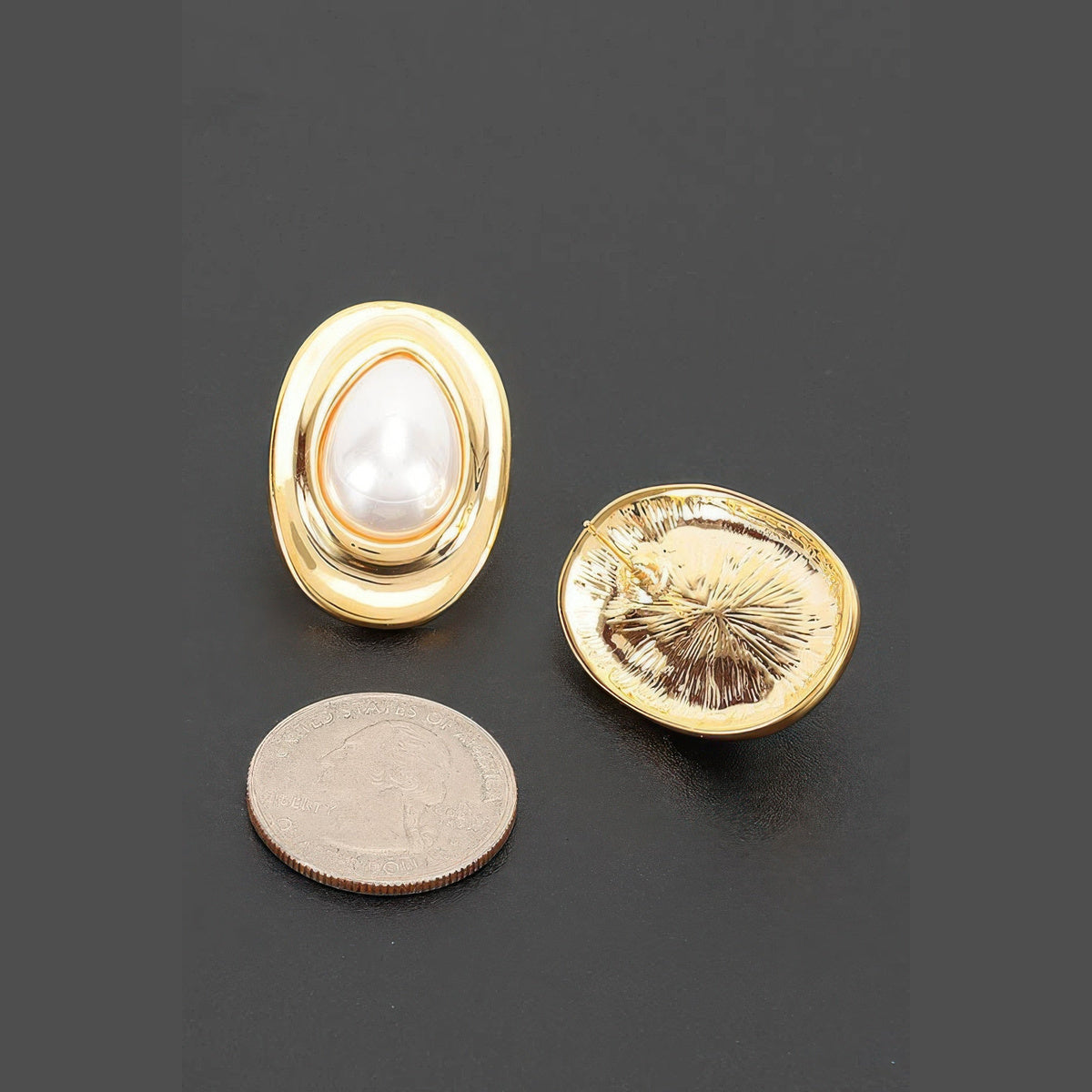 Layered Oval Pearl-Effect Stud Earrings in gold and pearl white, earring backs beside a coin for scale