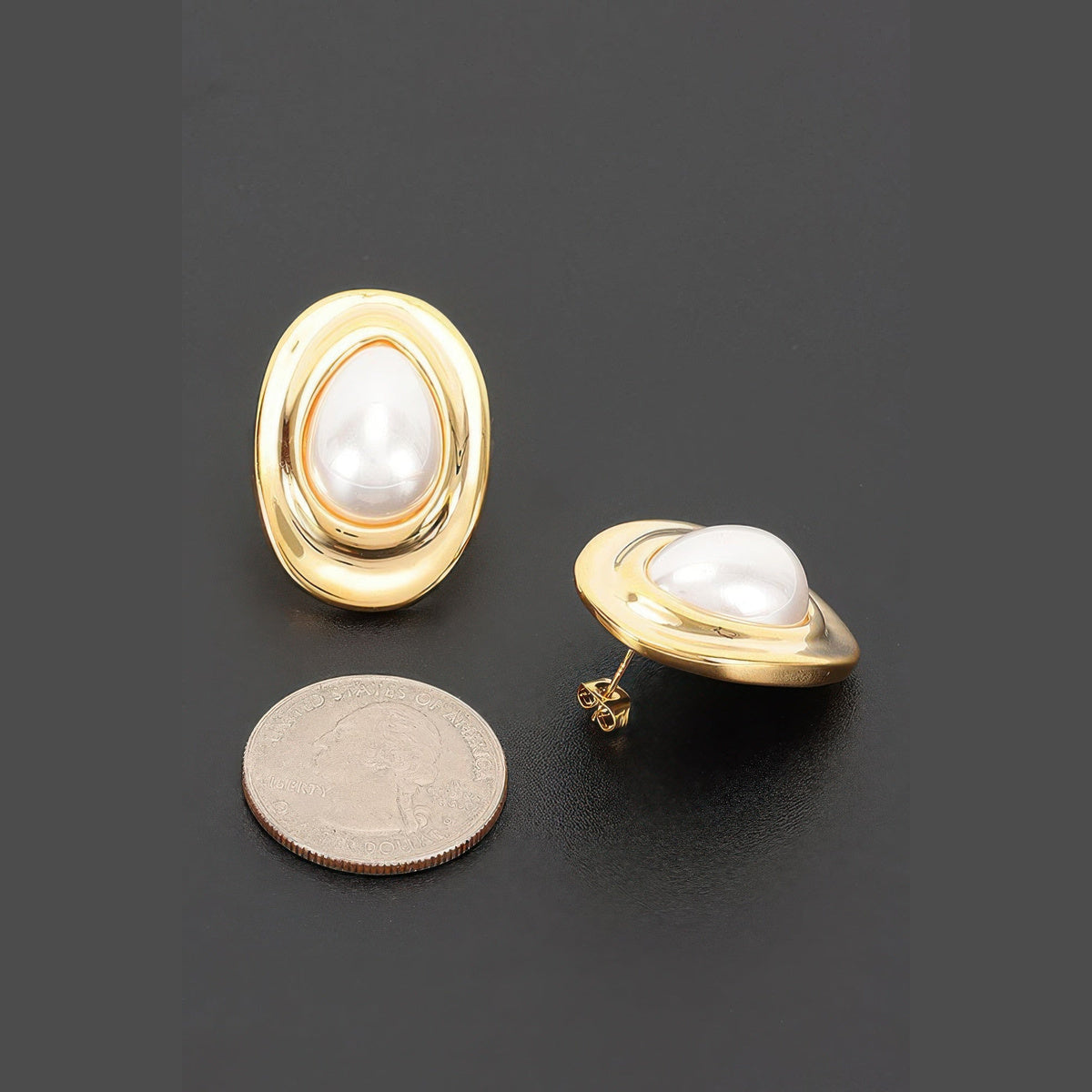 Layered Oval Pearl-Effect Stud Earrings in gold and pearl white, earring posts and side profile beside a coin for scale