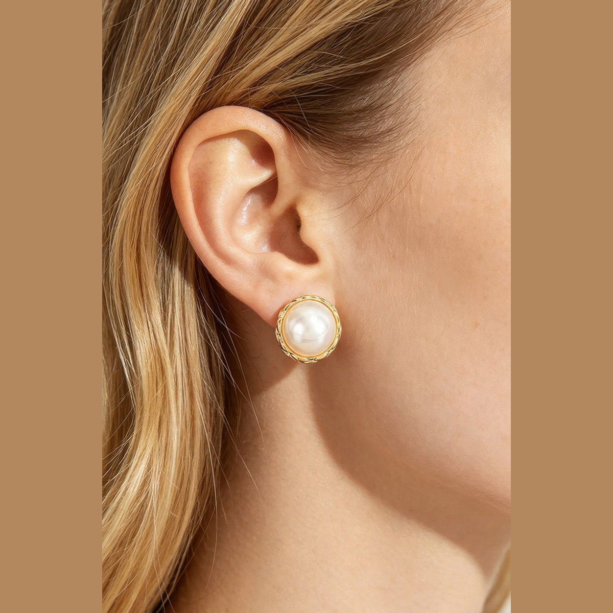 Braided Pearl-Effect Stud Earrings in gold and pearl white, styled on a model