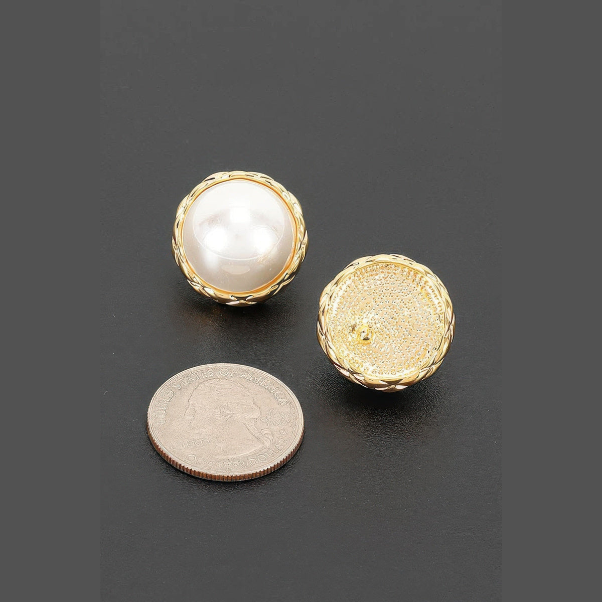 Braided Pearl-Effect Stud Earrings in gold and pearl white, earring backs beside a coin for scale