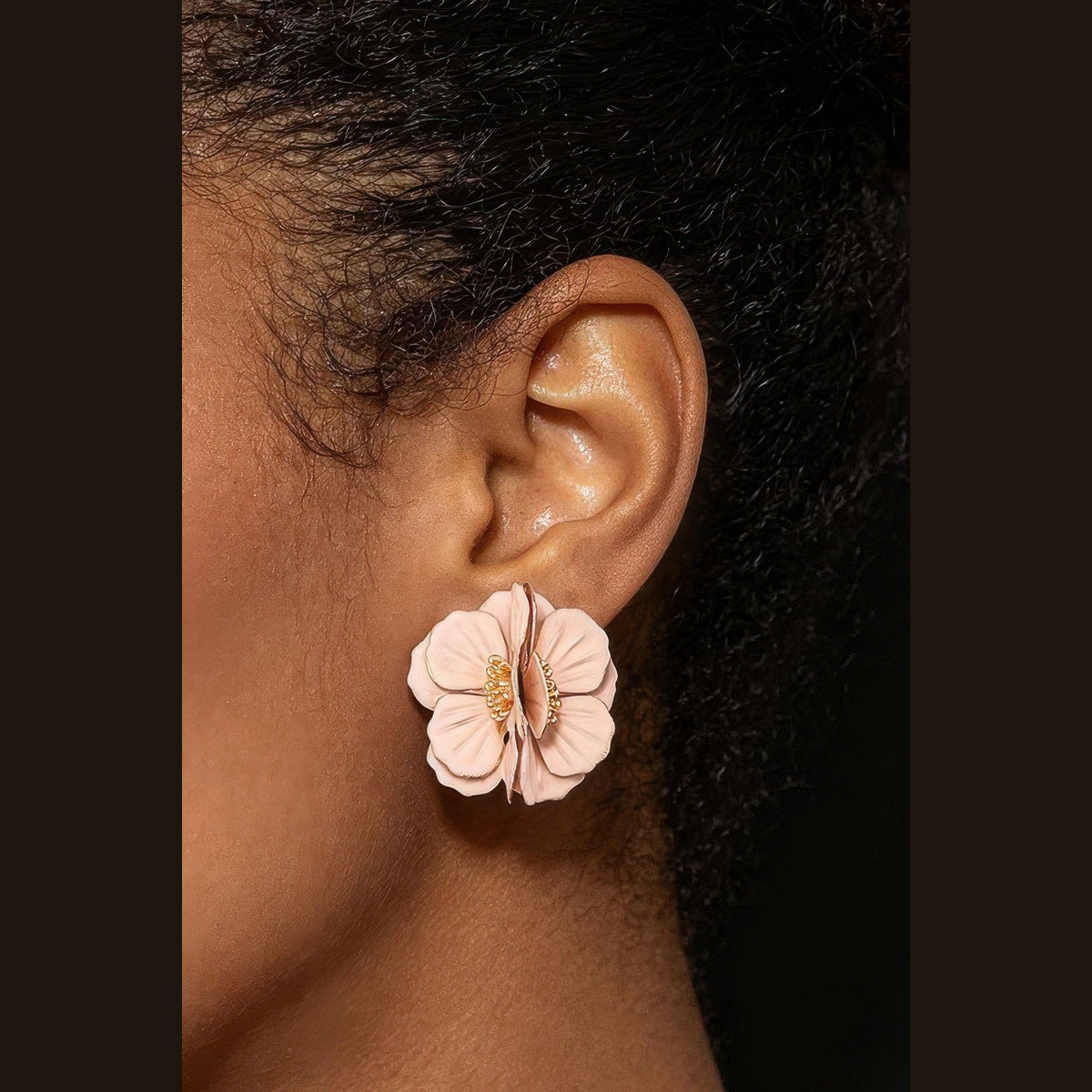 Layered Blossom Statement Earrings in gold and pink, styled on a model