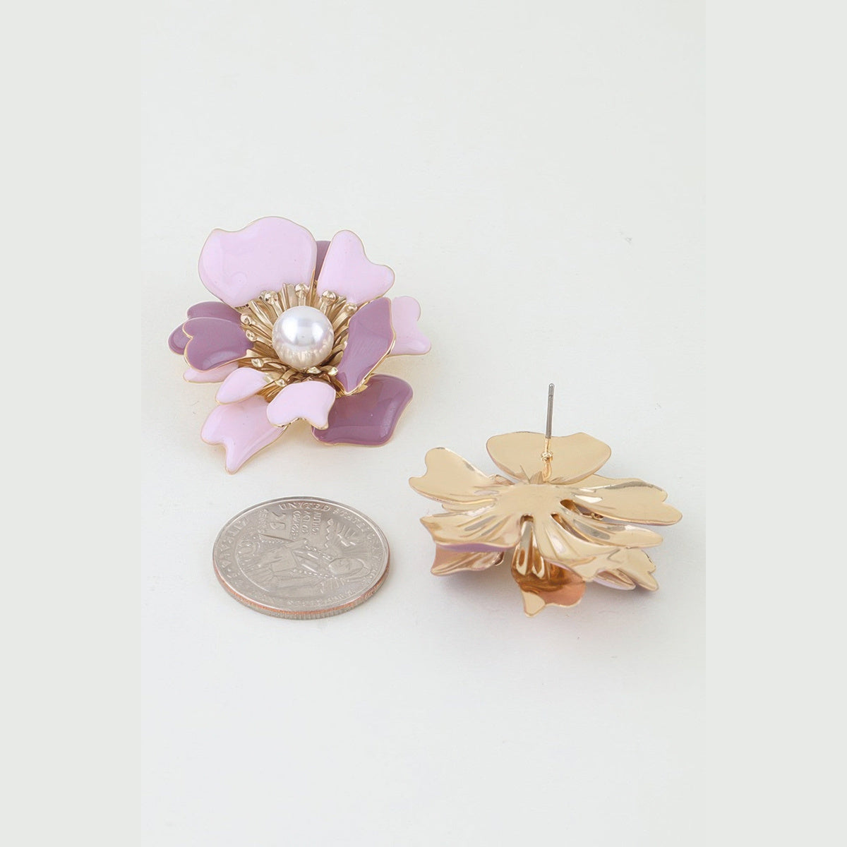 Marbled Blossom Statement Earrings in gold and pink, reverse view beside a coin for scale