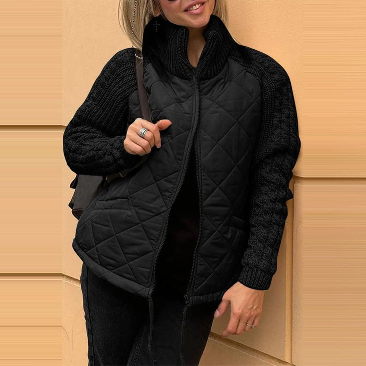 Quilted Knit-Sleeve Funnel Jacket in black, front view on a model
