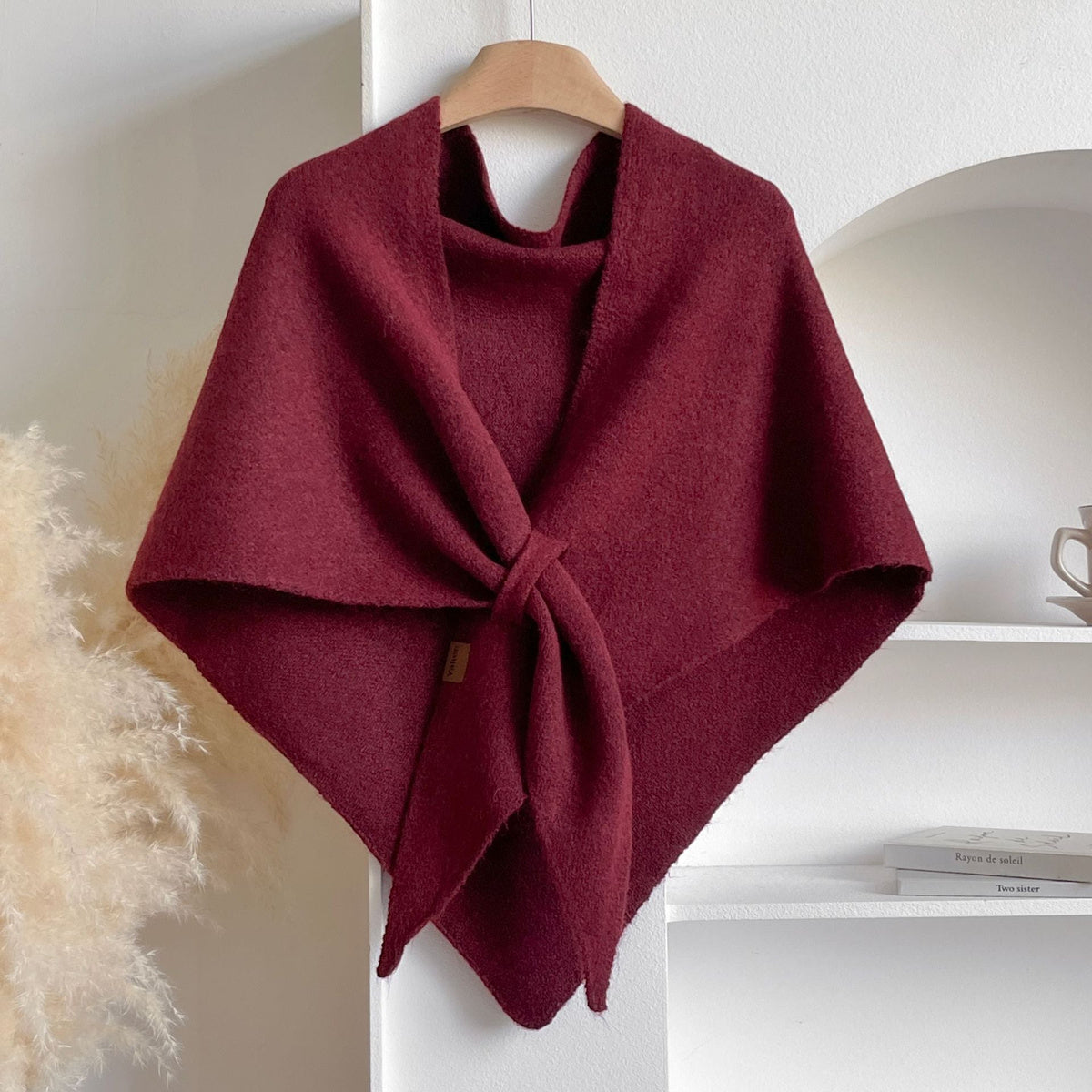 Soft Knit Triangle Shawl in wine red, displayed on a hanger