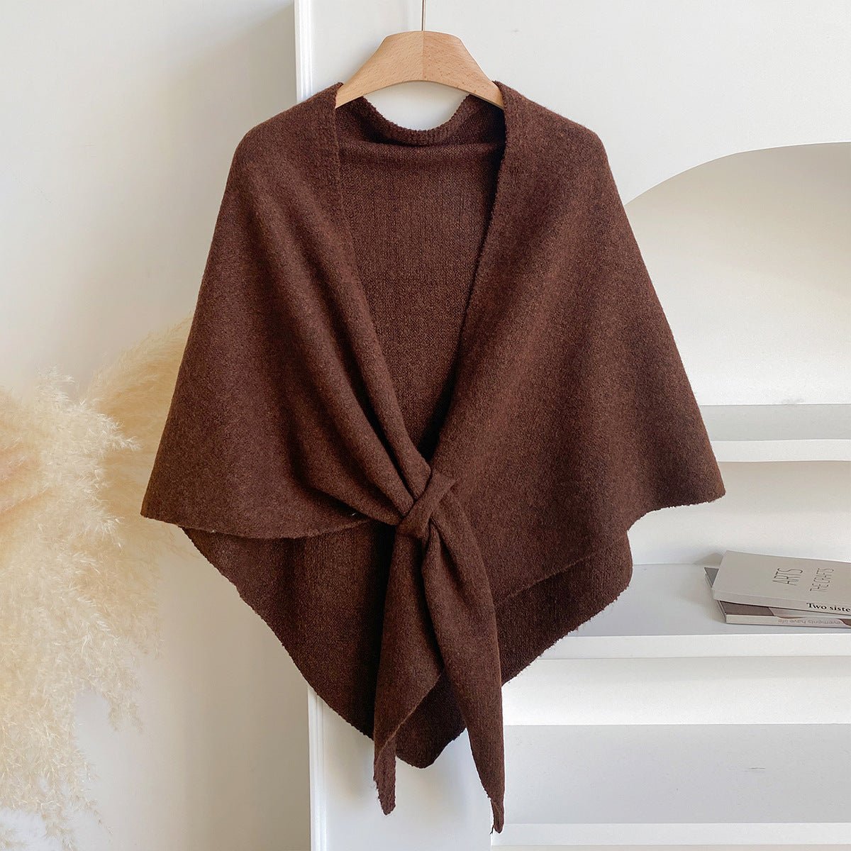 Soft Knit Triangle Shawl in brown, displayed on a hanger