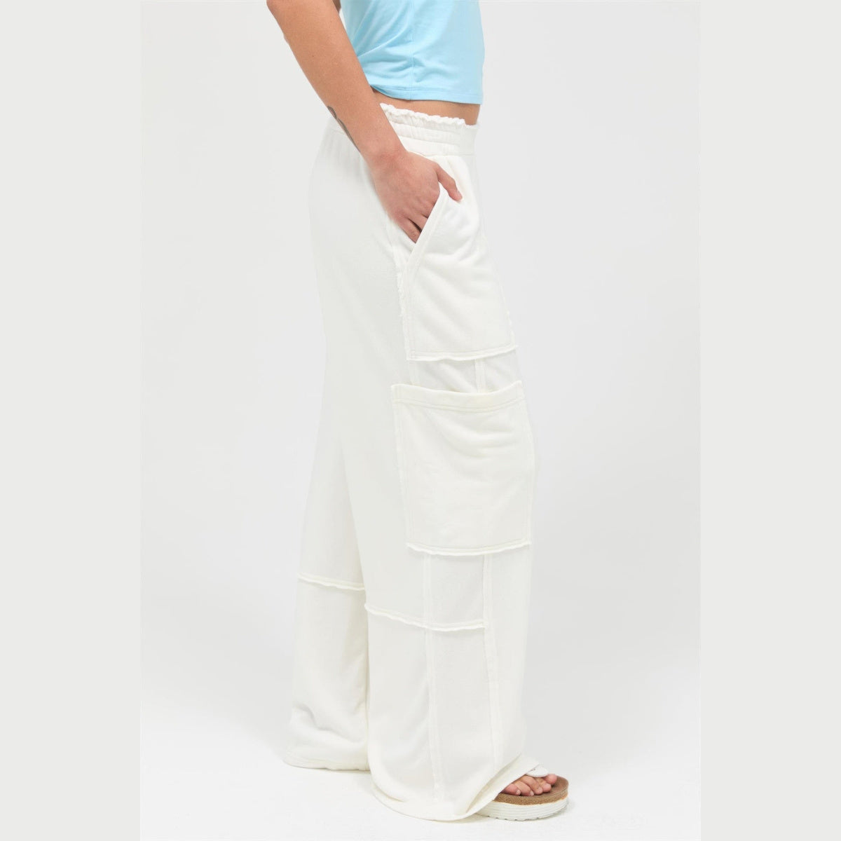 Mineral-Wash Wide-Leg Cargo Pants in cream, cargo pocket detail