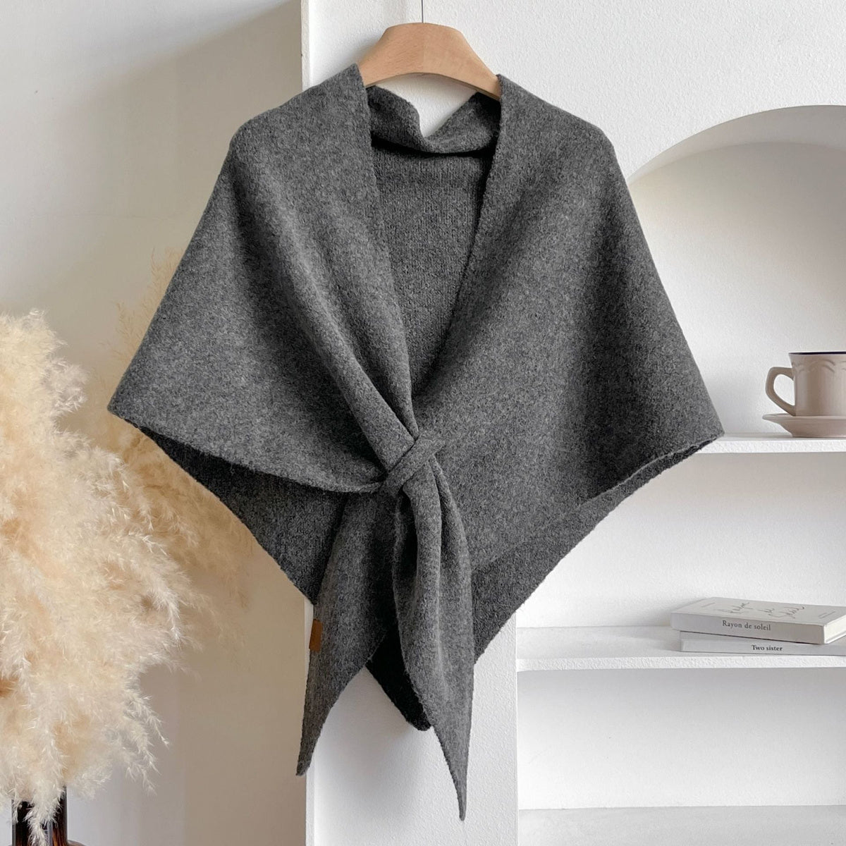 Soft Knit Triangle Shawl in dark gray, displayed on a hanger