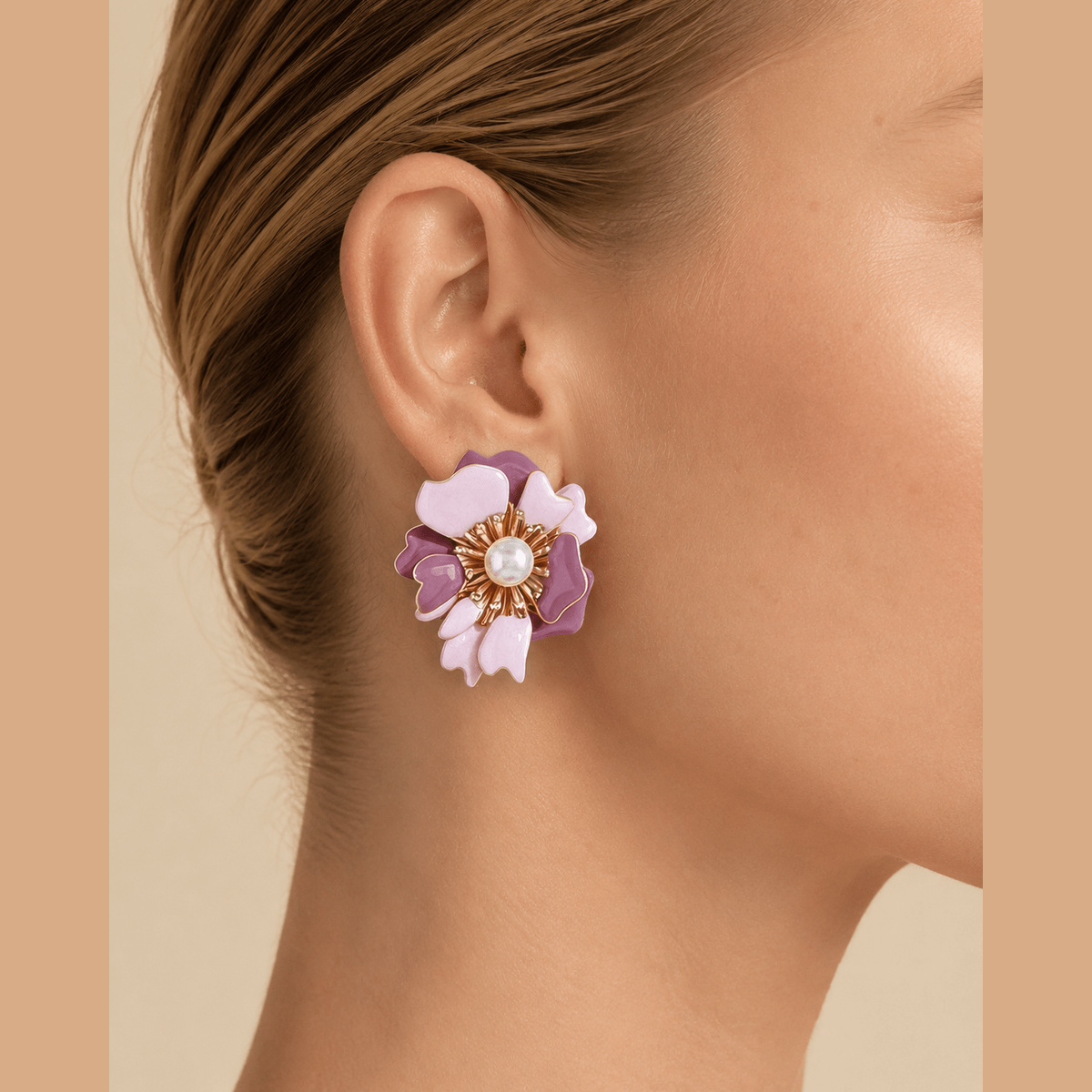 Marbled Blossom Statement Earrings in gold and pink, worn on the ear