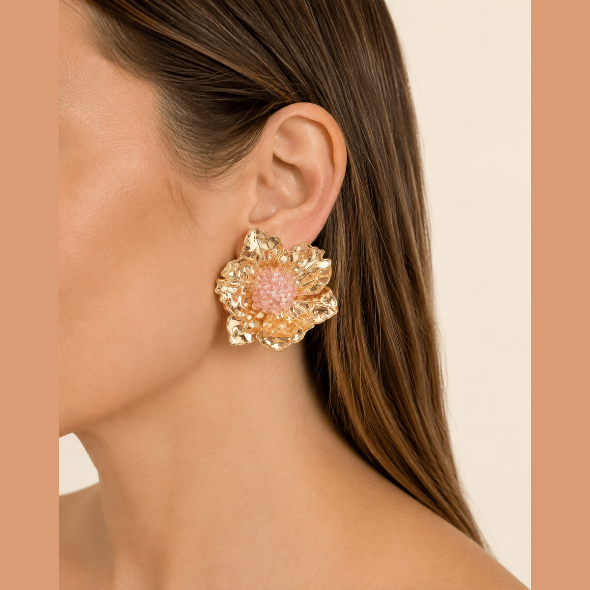 Pink Beaded Flower Statement Earrings in gold and pink, worn on the ear