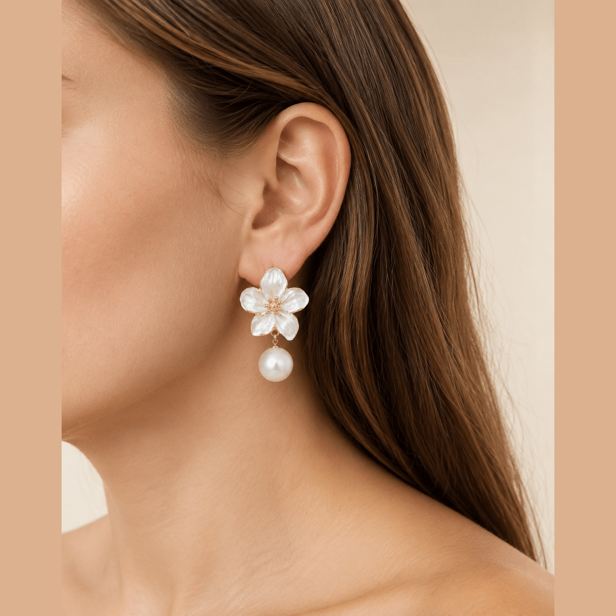 Pearl-Effect Flower Drop Earrings in gold and pearl white, worn on the ear