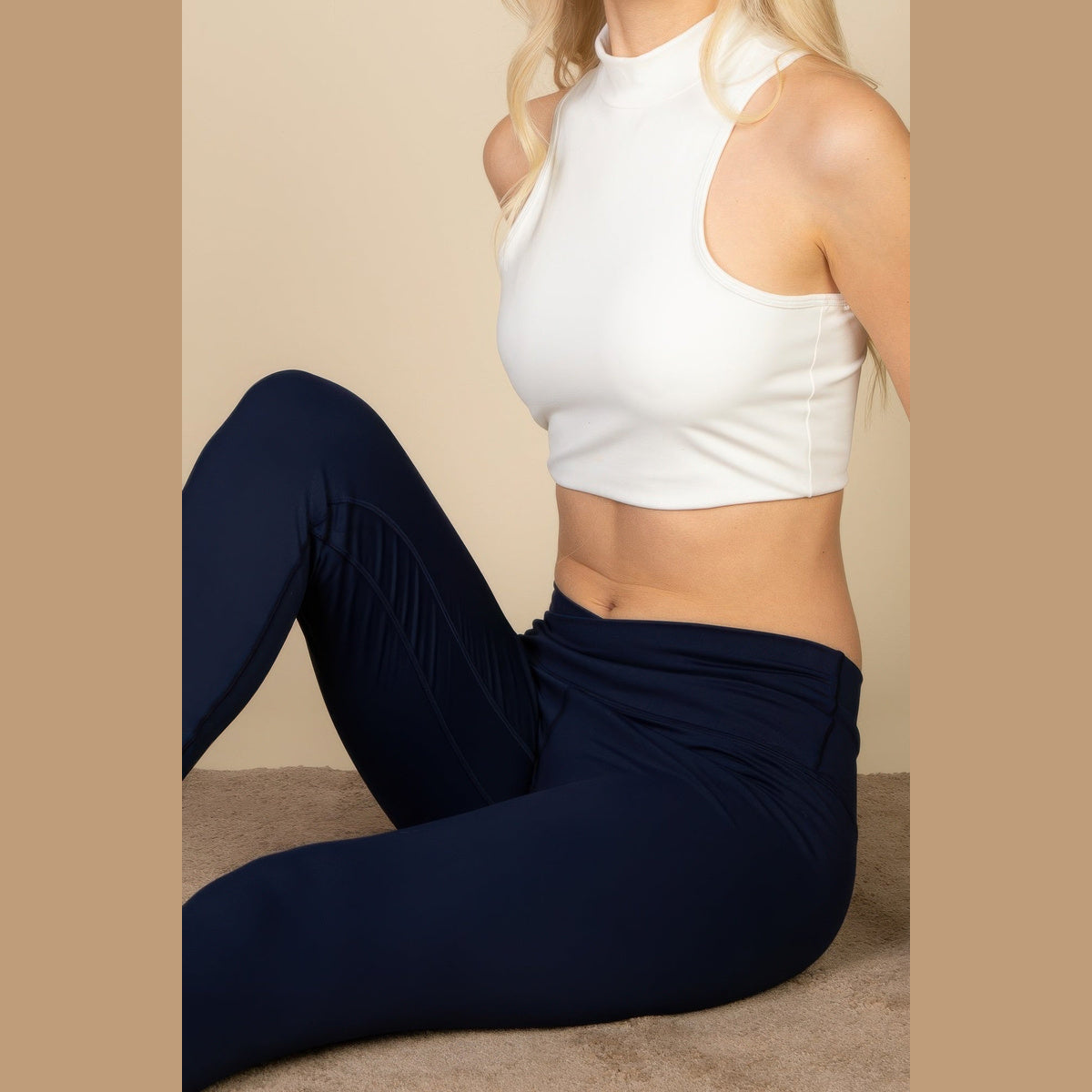 High-Neck Racerback Tank in white, hem detail