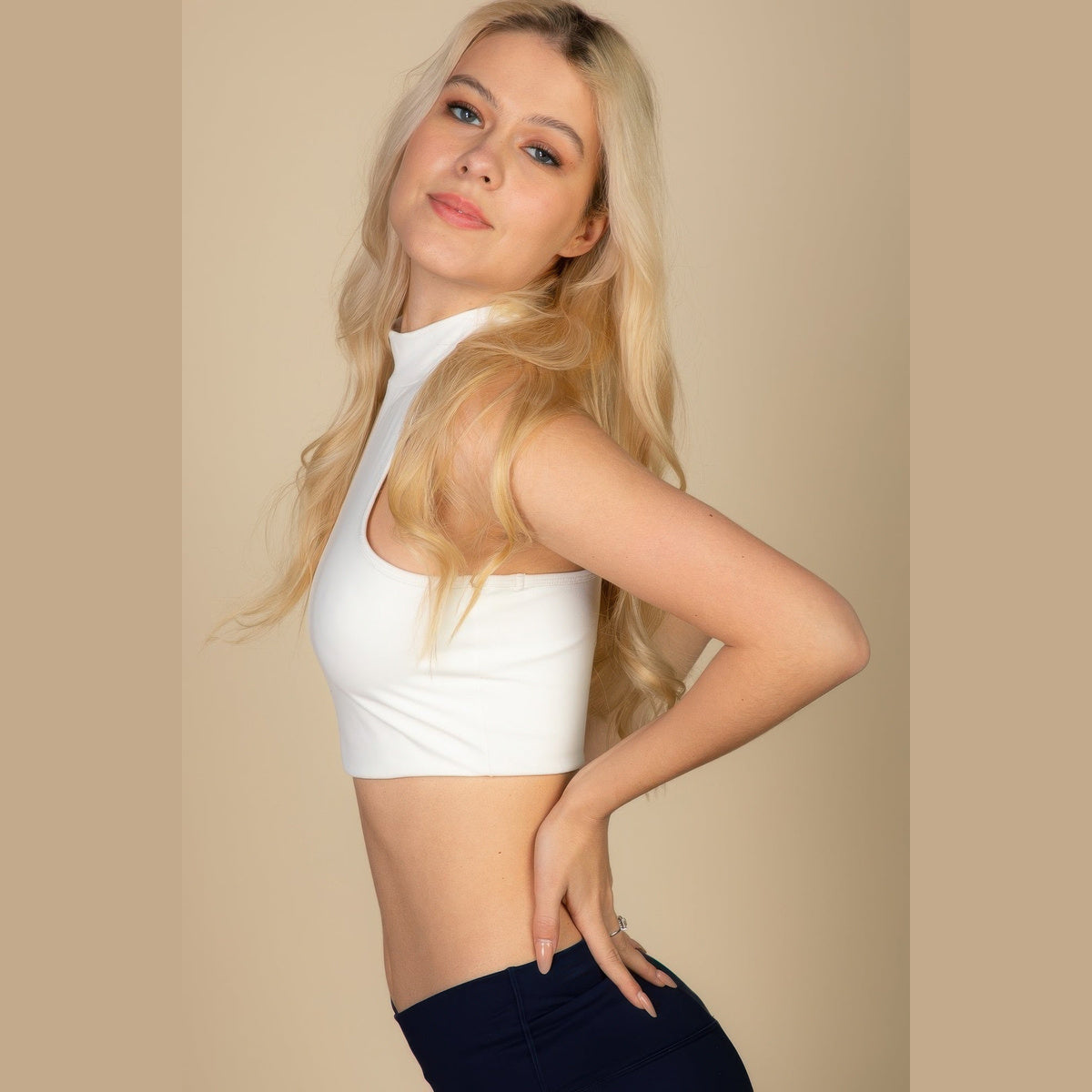 High-Neck Racerback Tank in white, front view on a model