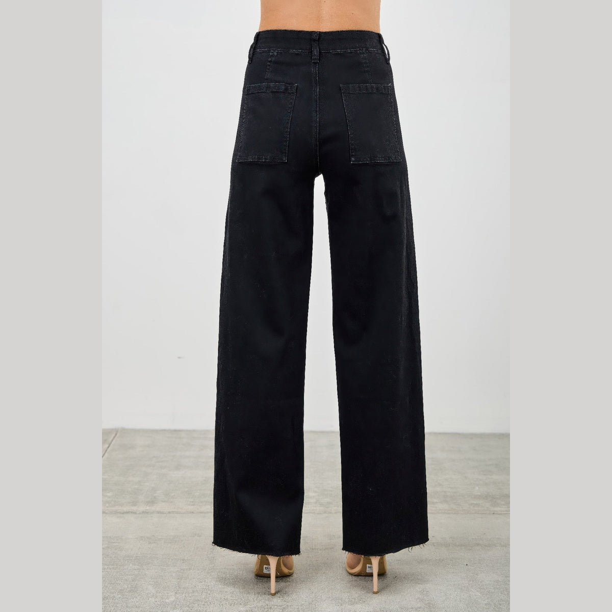 High-Rise Front-Seam Straight-Leg Jeans in black, back view of straight legs