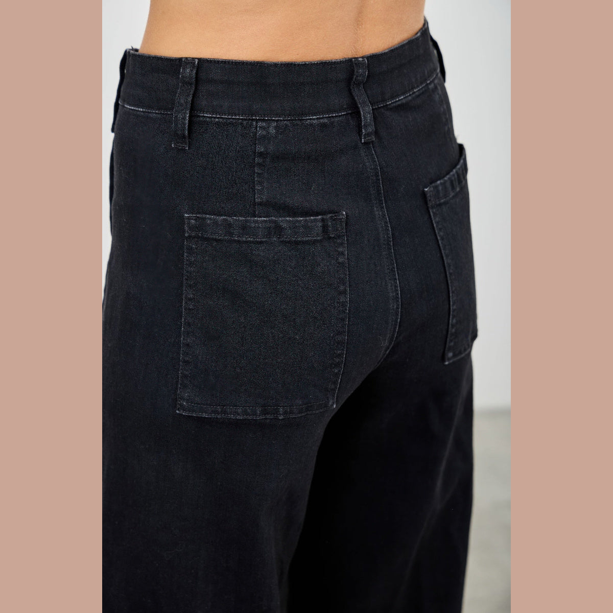 High-Rise Front-Seam Straight-Leg Jeans in black, back pocket detail