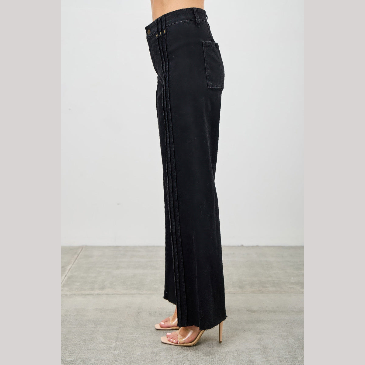High-Rise Front-Seam Straight-Leg Jeans in black, side view on a model