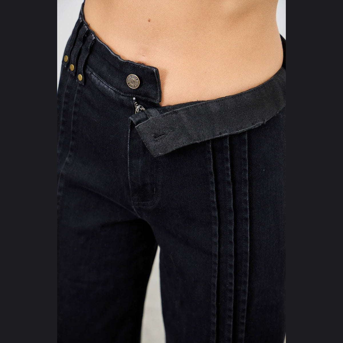 High-Rise Front-Seam Straight-Leg Jeans in black, waistband detail