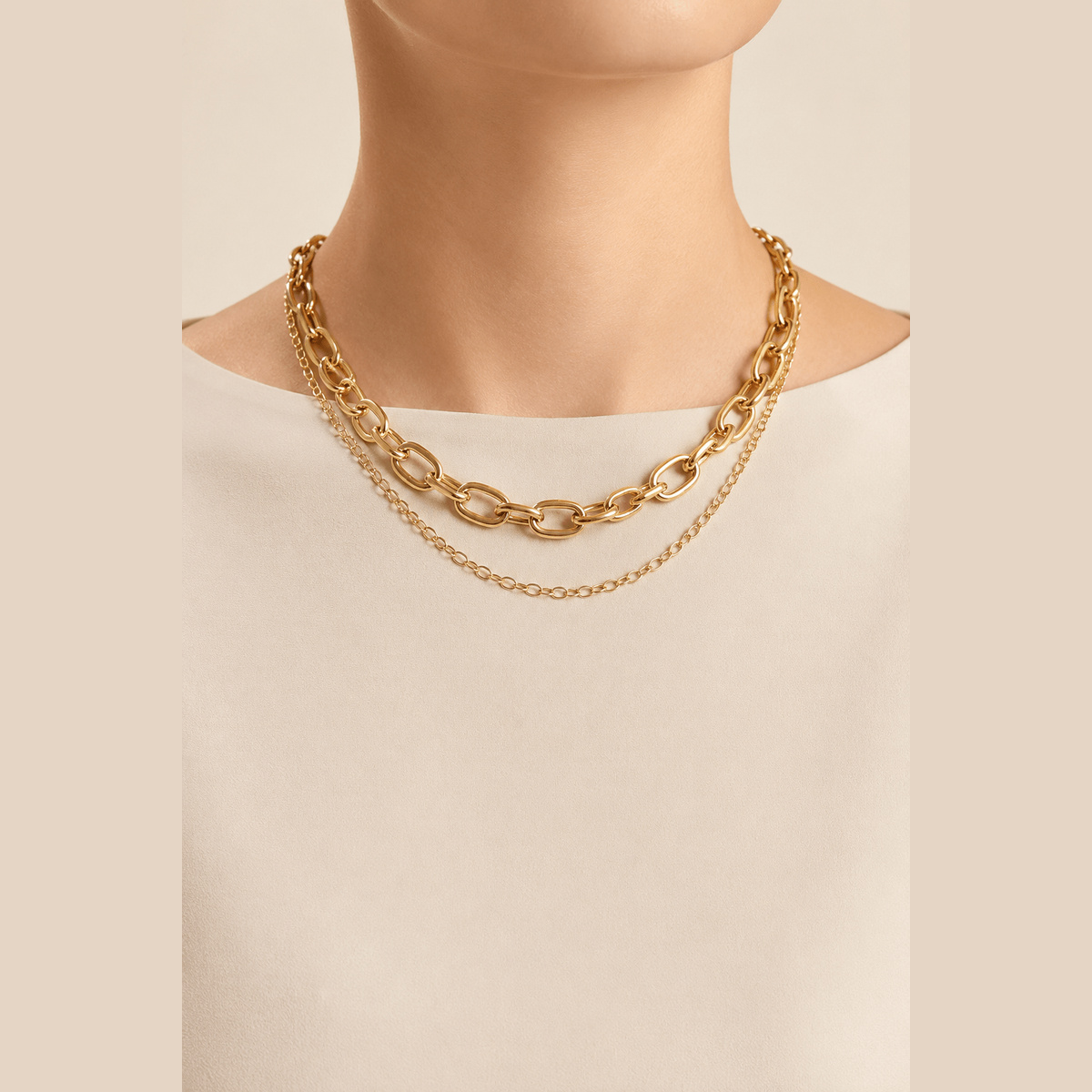Polished Oval-Link Layered Necklace in gold, worn around the neck