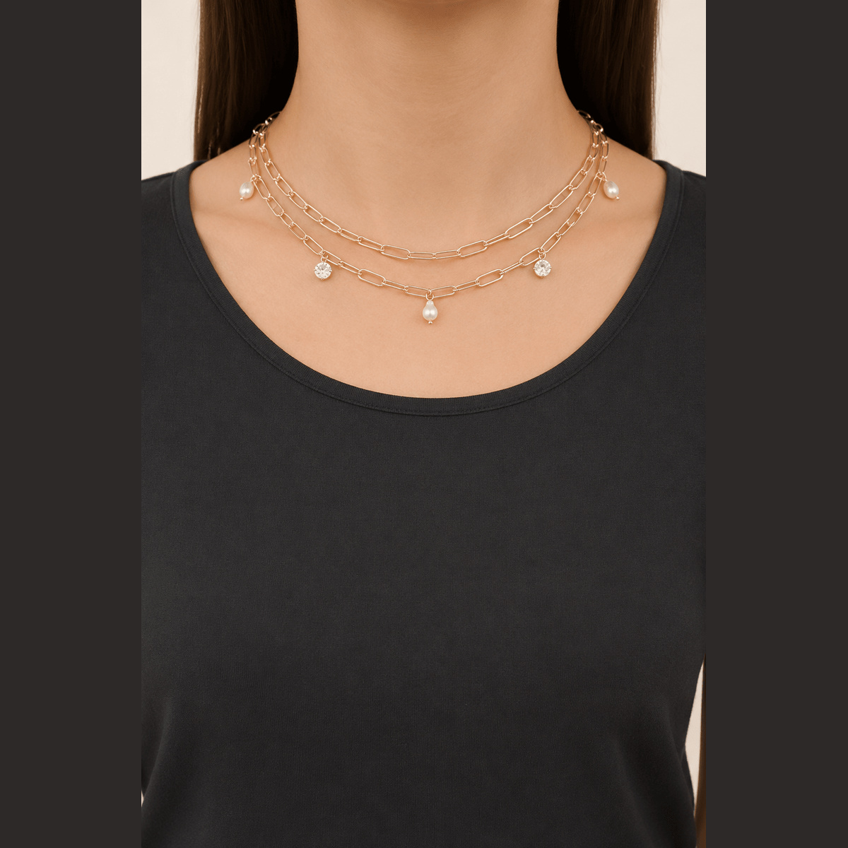 Pearl-Effect & Stone Paperclip Necklace in gold and cream, worn around the neck