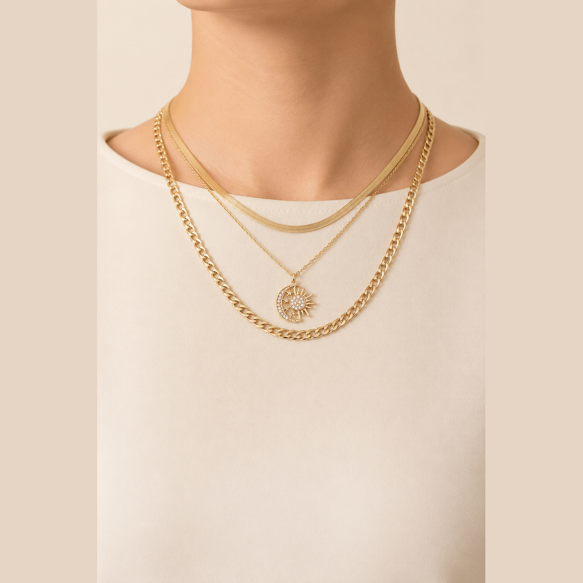 Sun & Moon Layered Necklace in gold with clear stones, worn around the neck