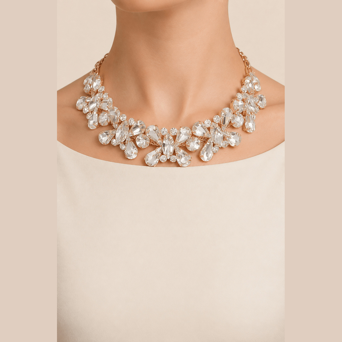Floral Stone Necklace & Earring Set in gold with clear stones, worn around the neck