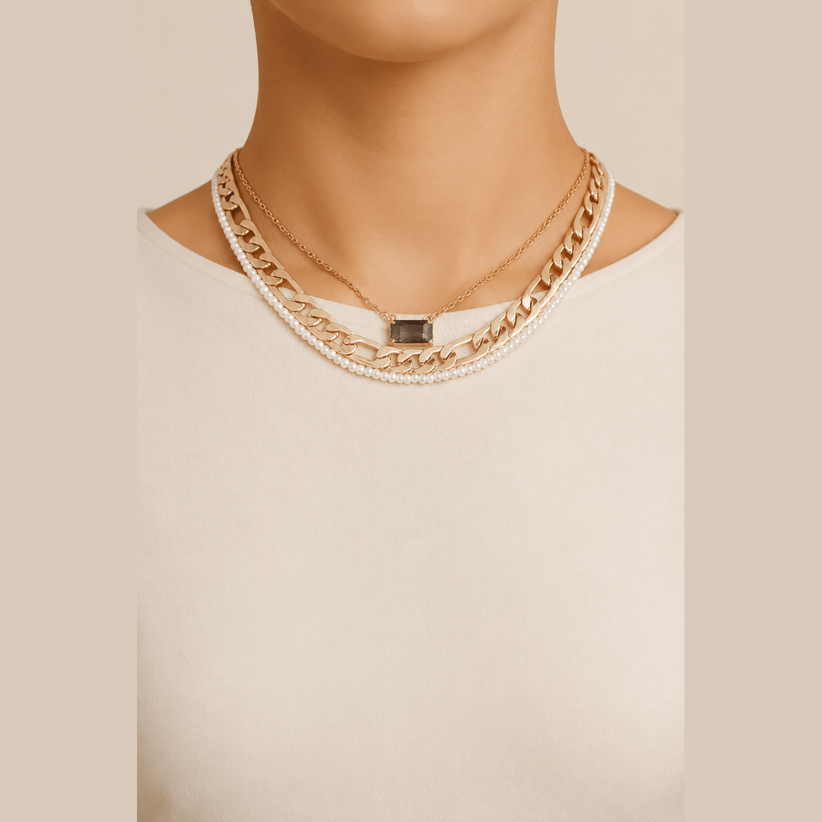 Jeweled & Pearl-Effect Layered Necklace in gold and cream, worn around the neck