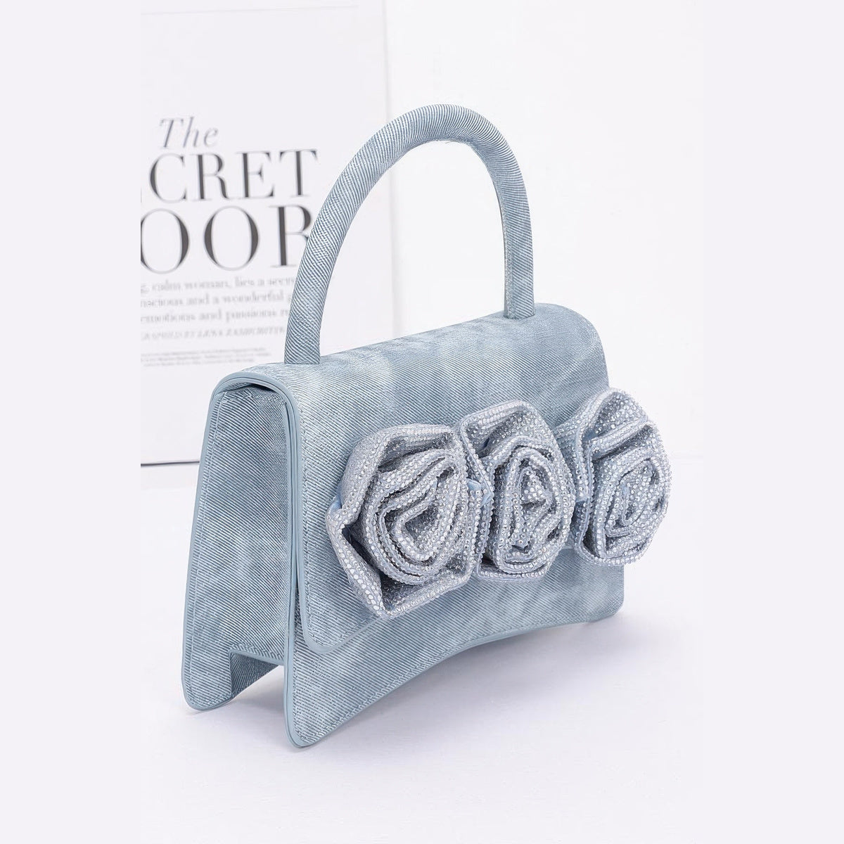 Rhinestone Flower Statement Bag in blue, side view