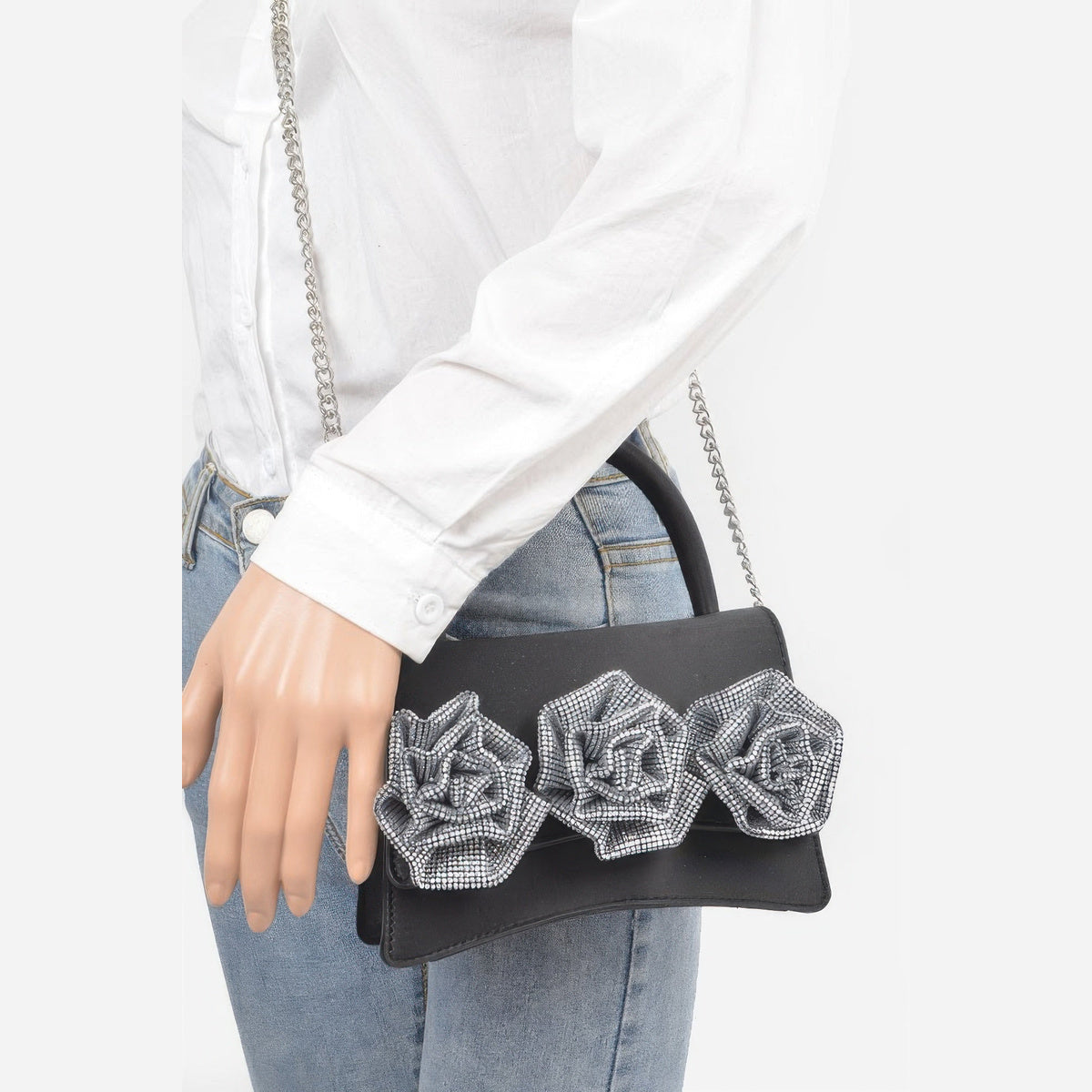 Rhinestone Flower Statement Bag in black, carried by a model