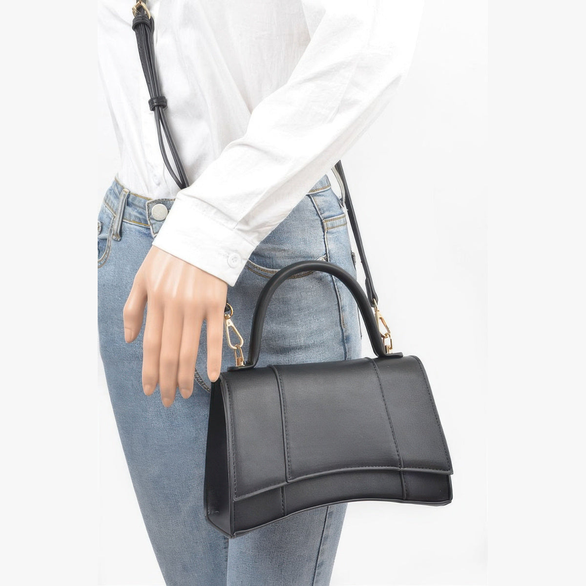 Structured Top Handle Bag in black, carried by a model