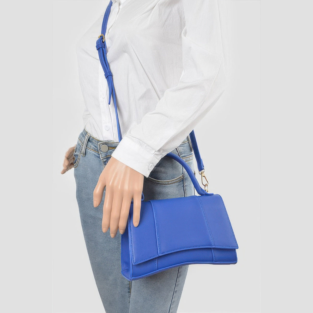 Structured Top Handle Bag in cobalt, carried by a model