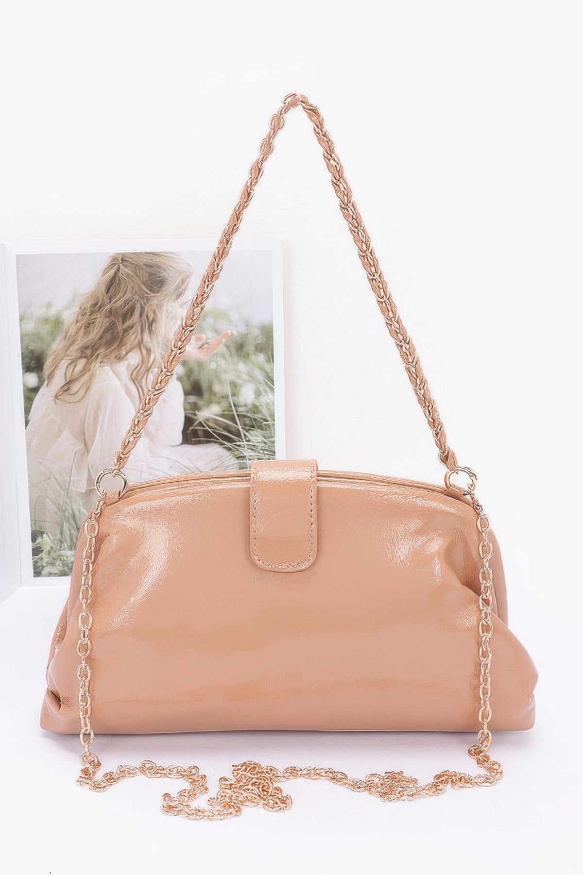 Glossy frame shoulder handbag detail view