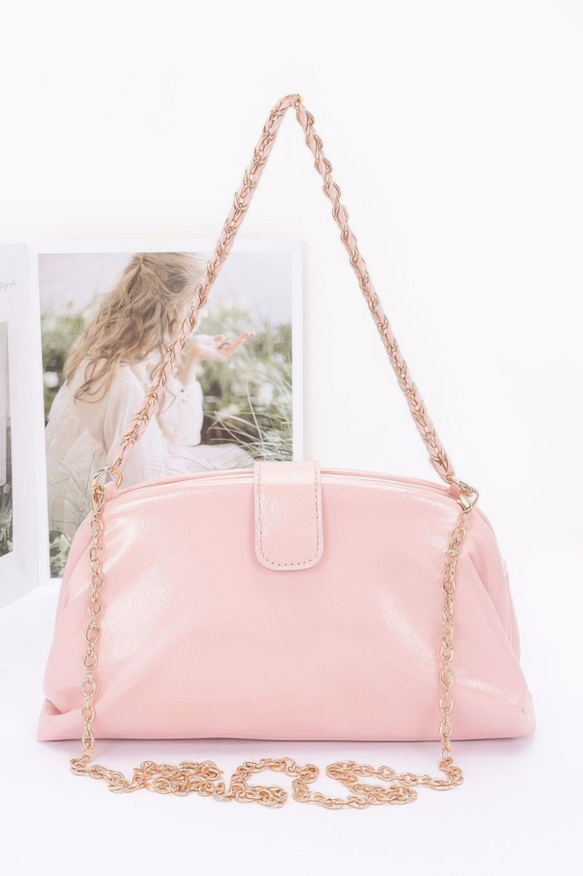 Glossy frame shoulder handbag detail view